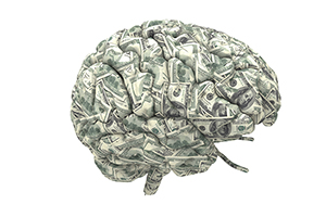 A graphic illustration of a brain covered in dollar bills.