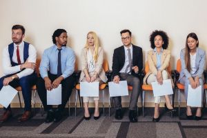 Diverse group of people waiting to be interviewed for a job.