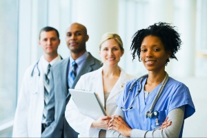 Four hospital workers lined up in a row. Nurse, Doctor, Administrator, Researcher