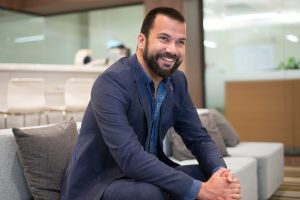 Smiling man with a beard in a suit in his 40s