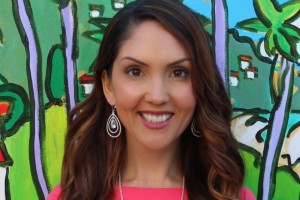 Woman smiling. Long brown hair.