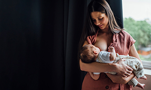 Lactation consultant with new mother and baby.